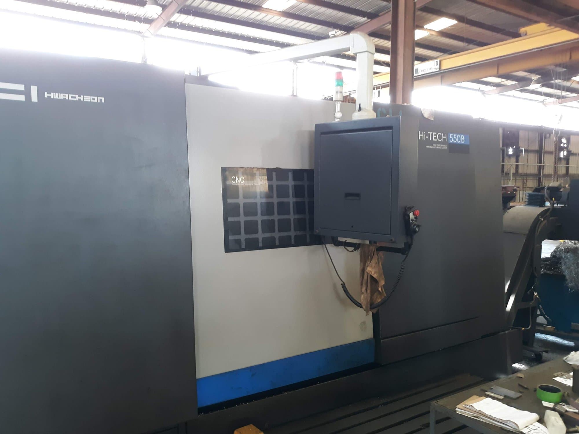 Hwacheon Hi-Tech 550B CNC Lathe, 2012- Tailstock, Chip Conveyor