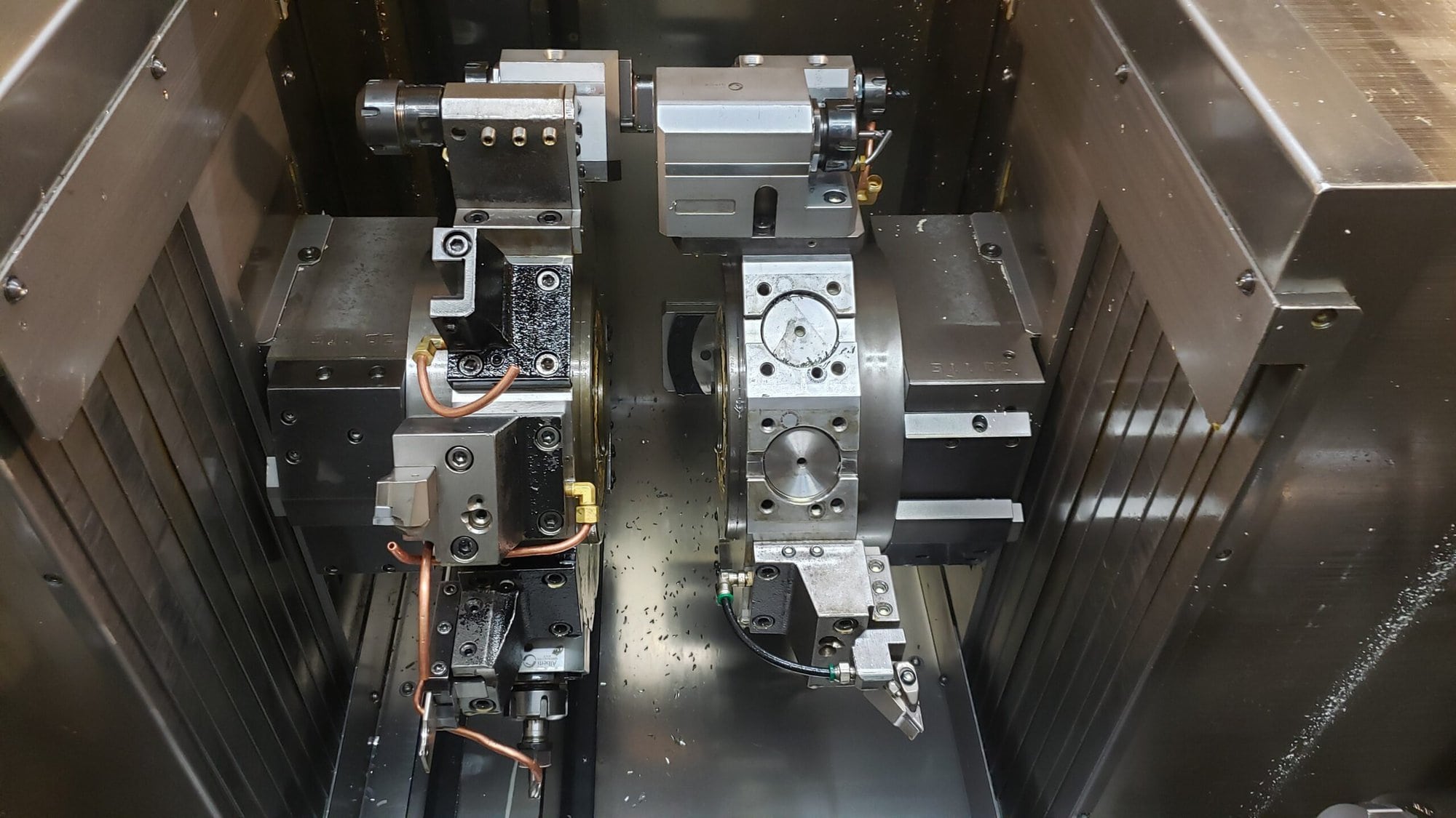 NAKAMURA-TOME WTW-150 CNC Turning Center, 2003 - 4 Turrets, Live Tooling, Chip Conveyor, Under Power Making Precision Parts - Image 3