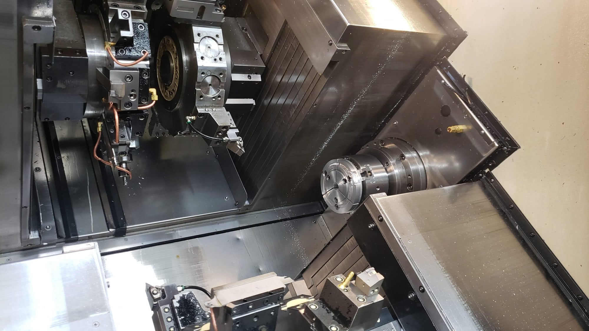 NAKAMURA-TOME WTW-150 CNC Turning Center, 2003 - 4 Turrets, Live Tooling, Chip Conveyor, Under Power Making Precision Parts - Image 6