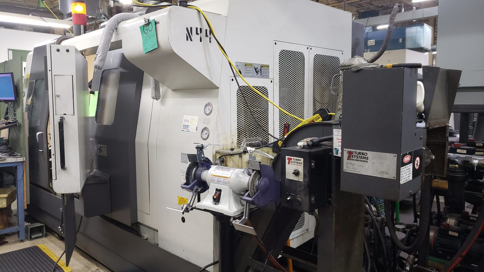 NAKAMURA-TOME WTW-150 CNC Turning Center, 2003 - 4 Turrets, Live Tooling, Chip Conveyor, Under Power Making Precision Parts - Image 9