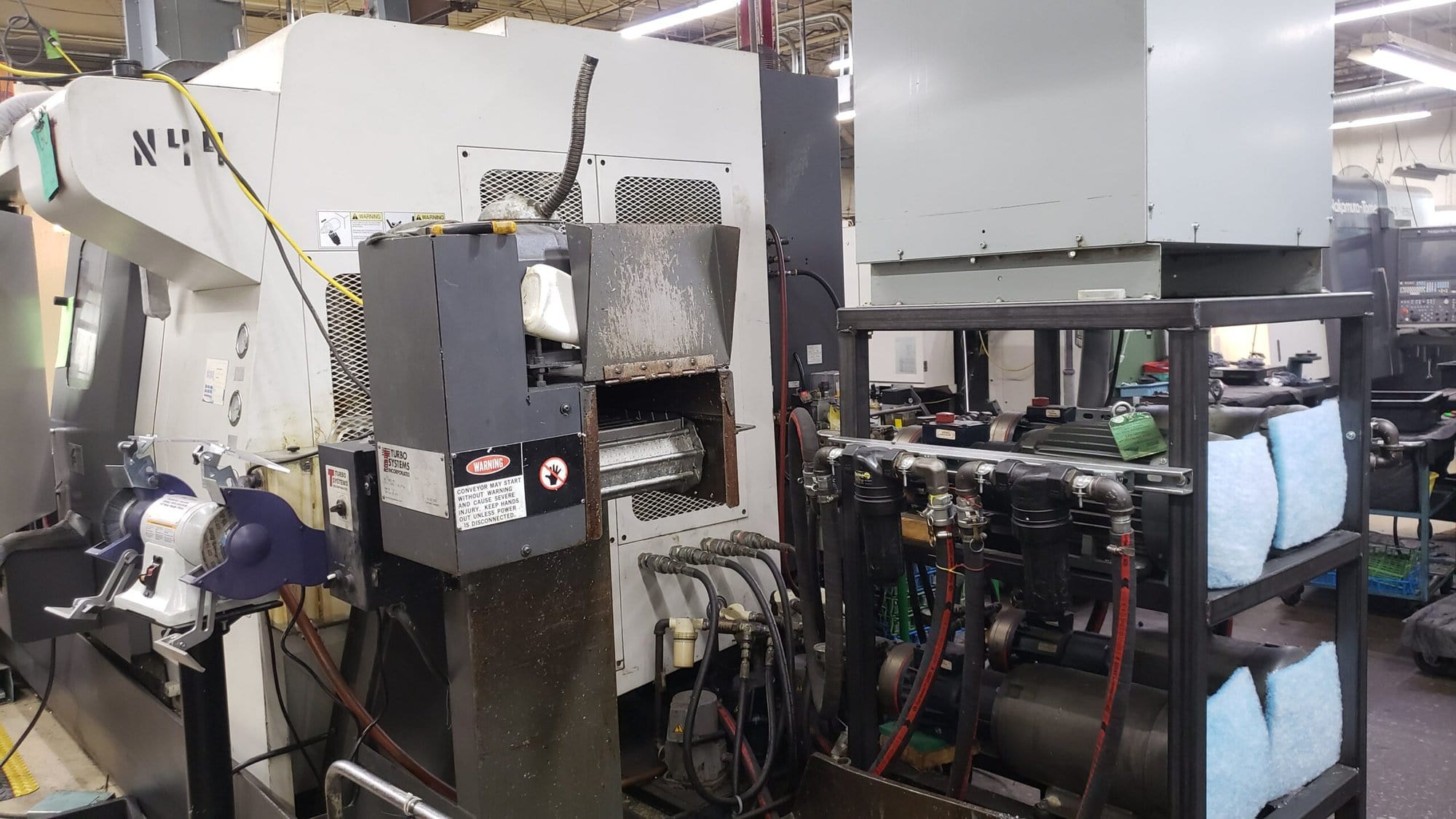 NAKAMURA-TOME WTW-150 CNC Turning Center, 2003 - 4 Turrets, Live Tooling, Chip Conveyor, Under Power Making Precision Parts - Image 10
