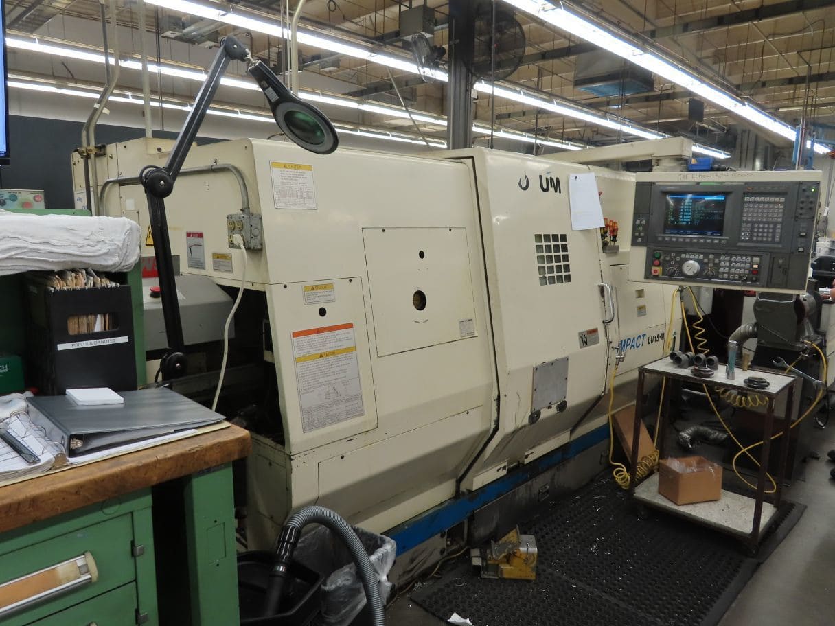 Okuma Impact LU-15M CNC Lathe, 1996 - Live Tooling, Bar Feeder, Twin Turret, Chip Conveyor, Manuals