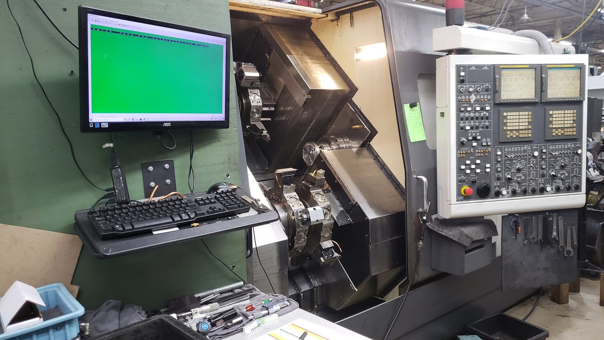 NAKAMURA-TOME WTW-150 CNC Turning Center, 2003 - 4 Turrets, Live Tooling, Chip Conveyor, Under Power Making Precision Parts