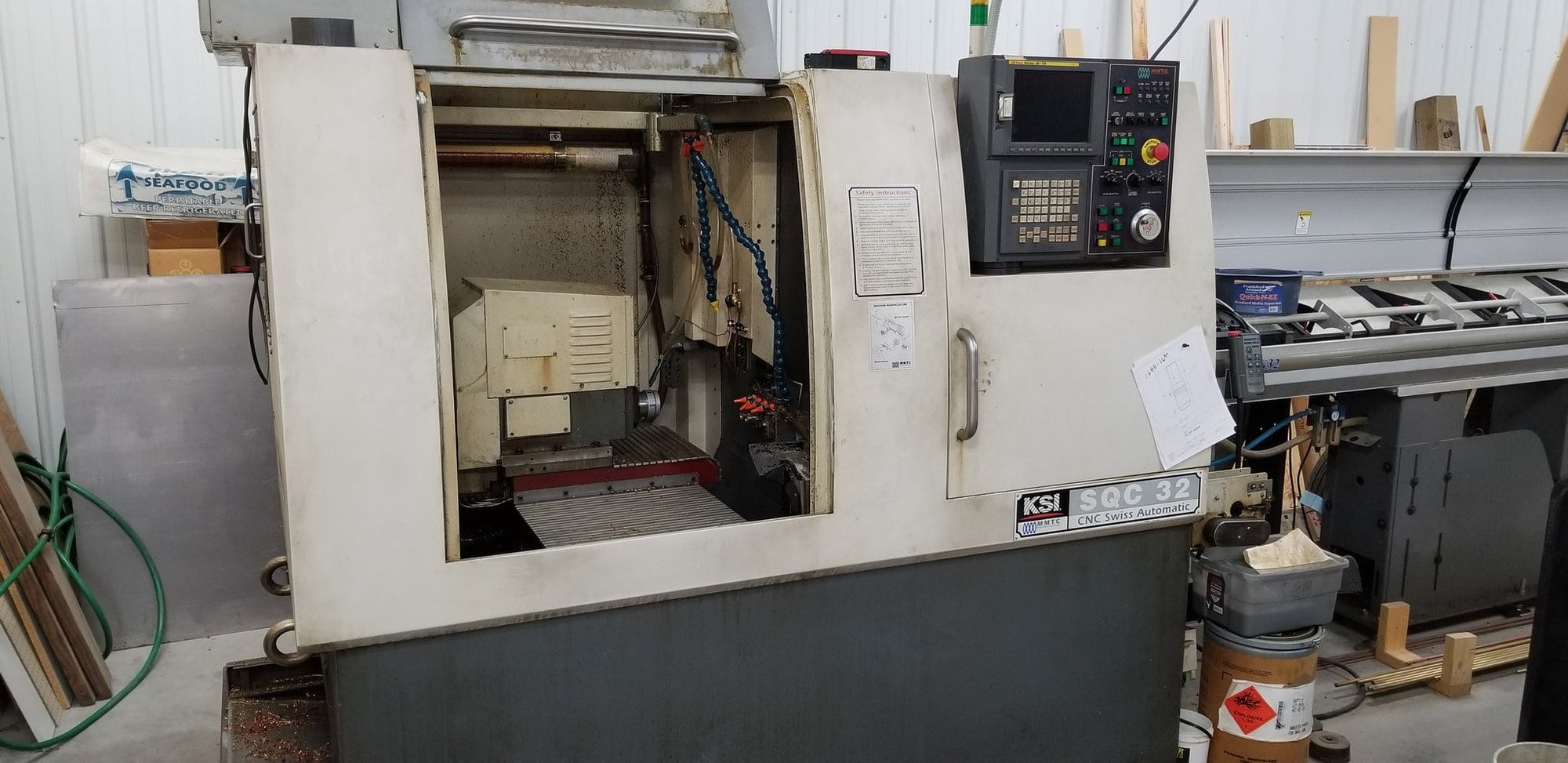 KSI SQC-32 CNC Swiss Lathe 2005 - 12' Bar Feed, Fanuc Control