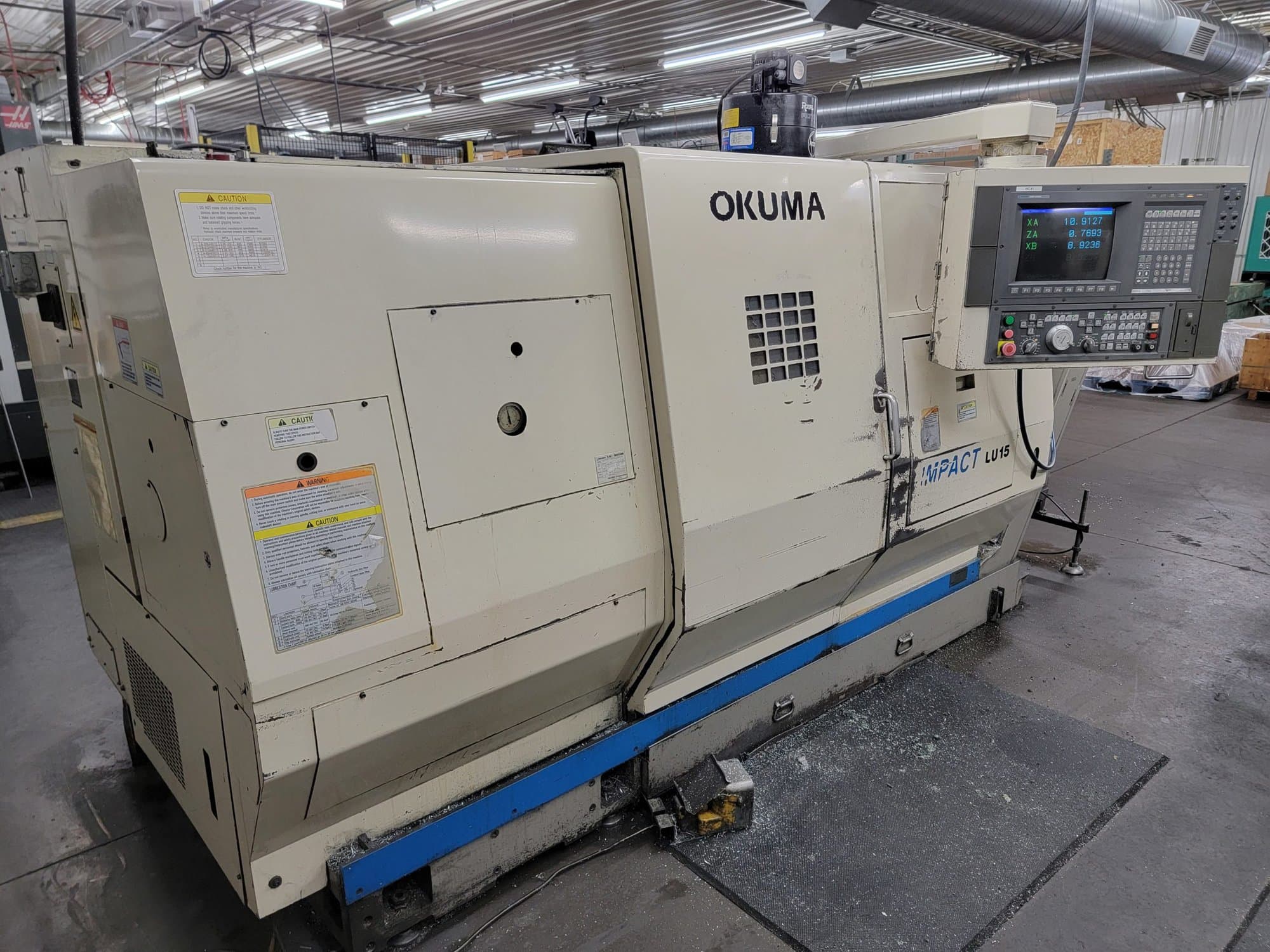 Okuma LU15 CNC Lathe, 2000 – Dual Turrets, Tooling Included, Chip Conveyor