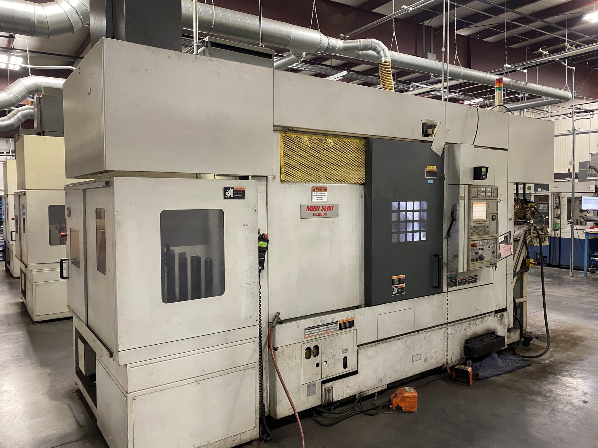 Mori Seiki NL2500SMC/700 CNC Lathe, 2011- sub spindle, live tooling, mist blaster, chip blaster, work stocker, gantry loader, available immediately