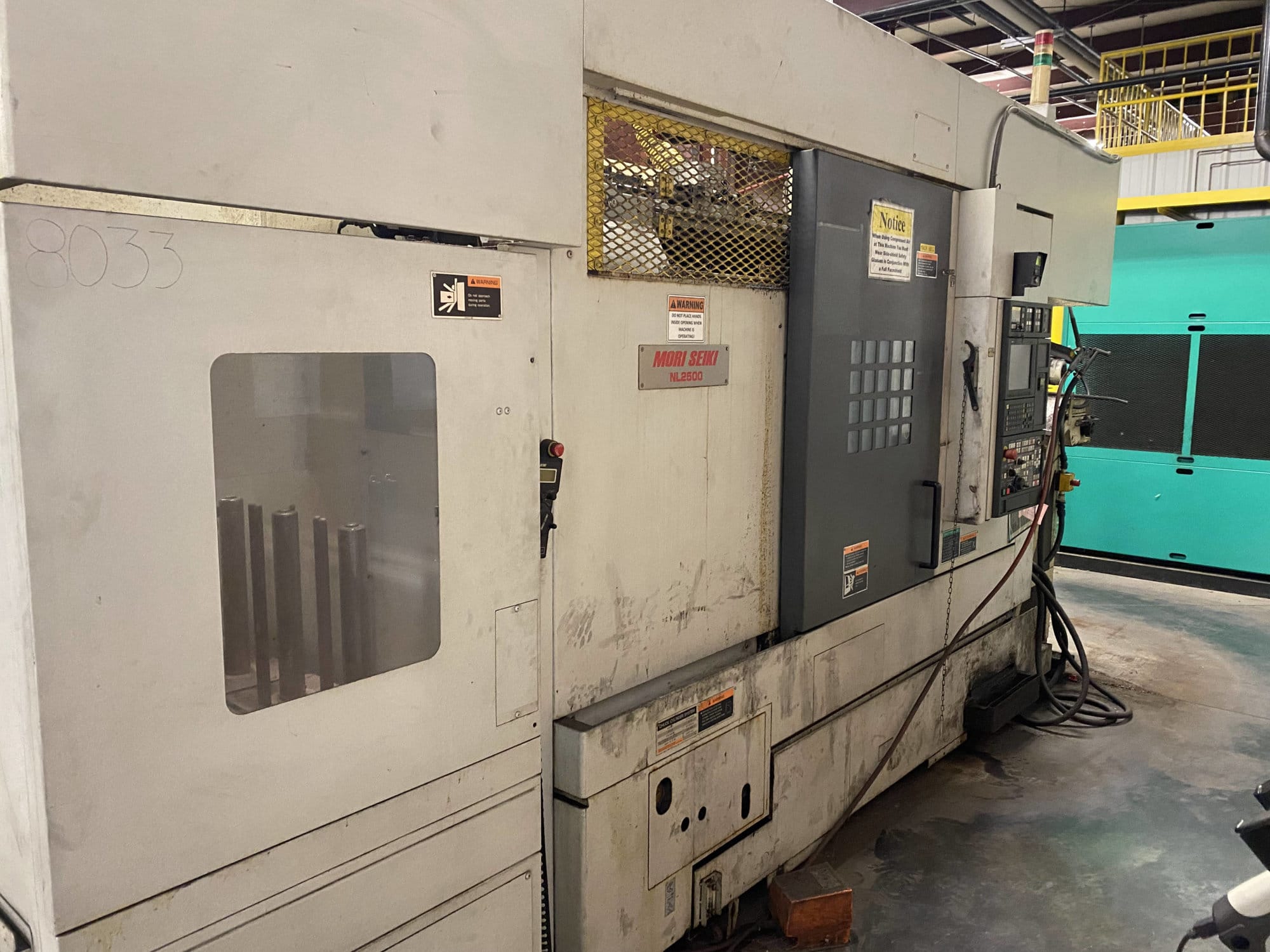 Mori Seiki NL2500MC/700 CNC Lathe, 2007/1- live tooling, mist blaster, chip blaster, work stocker, gantry loader, available immediately