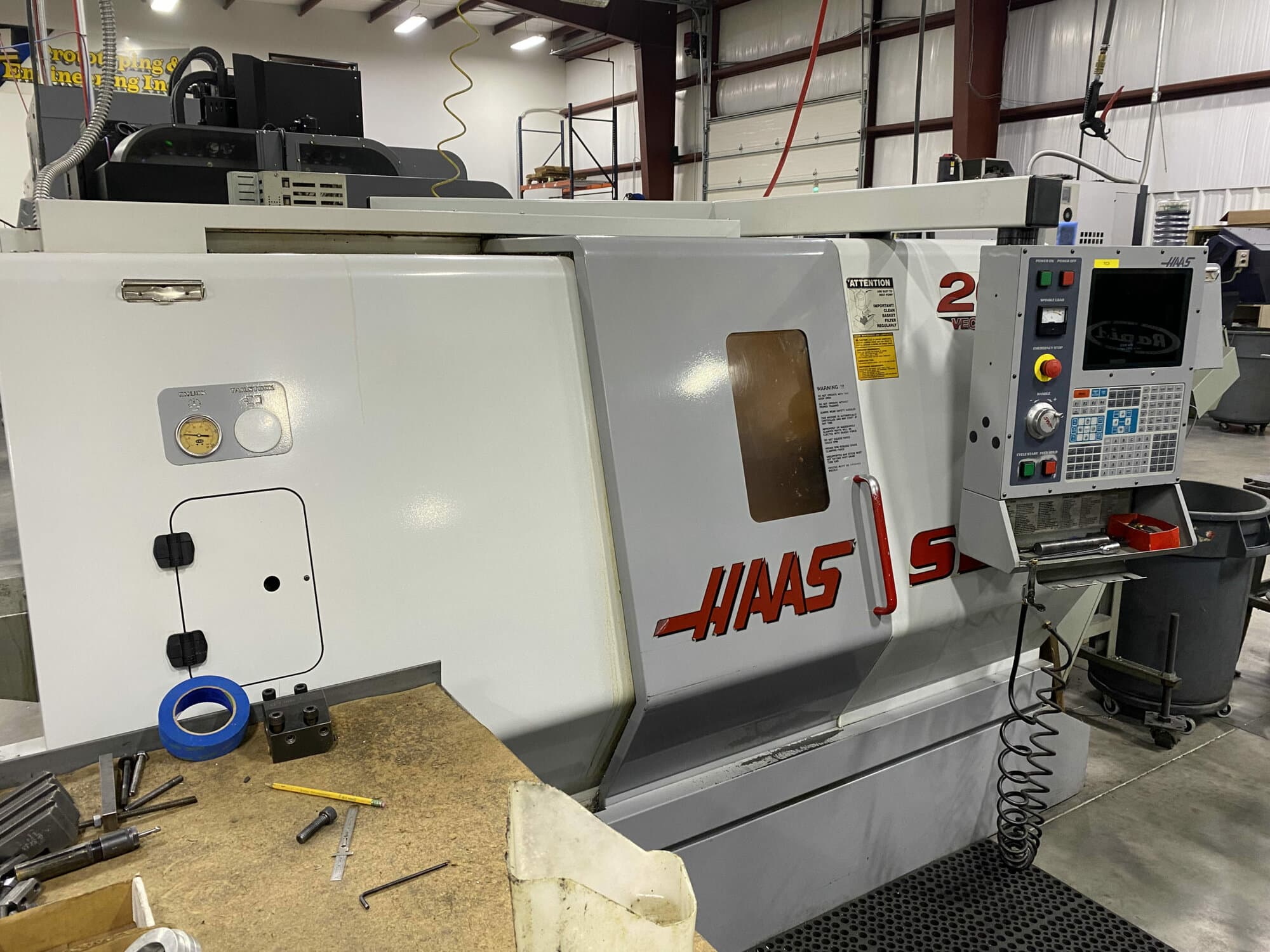 Haas SL-20 CNC Lathe, 2002- Updated Control Screen, Chip Conveyor, Collet Chuck System, 3 Jaw Chuck, Tool holders Included