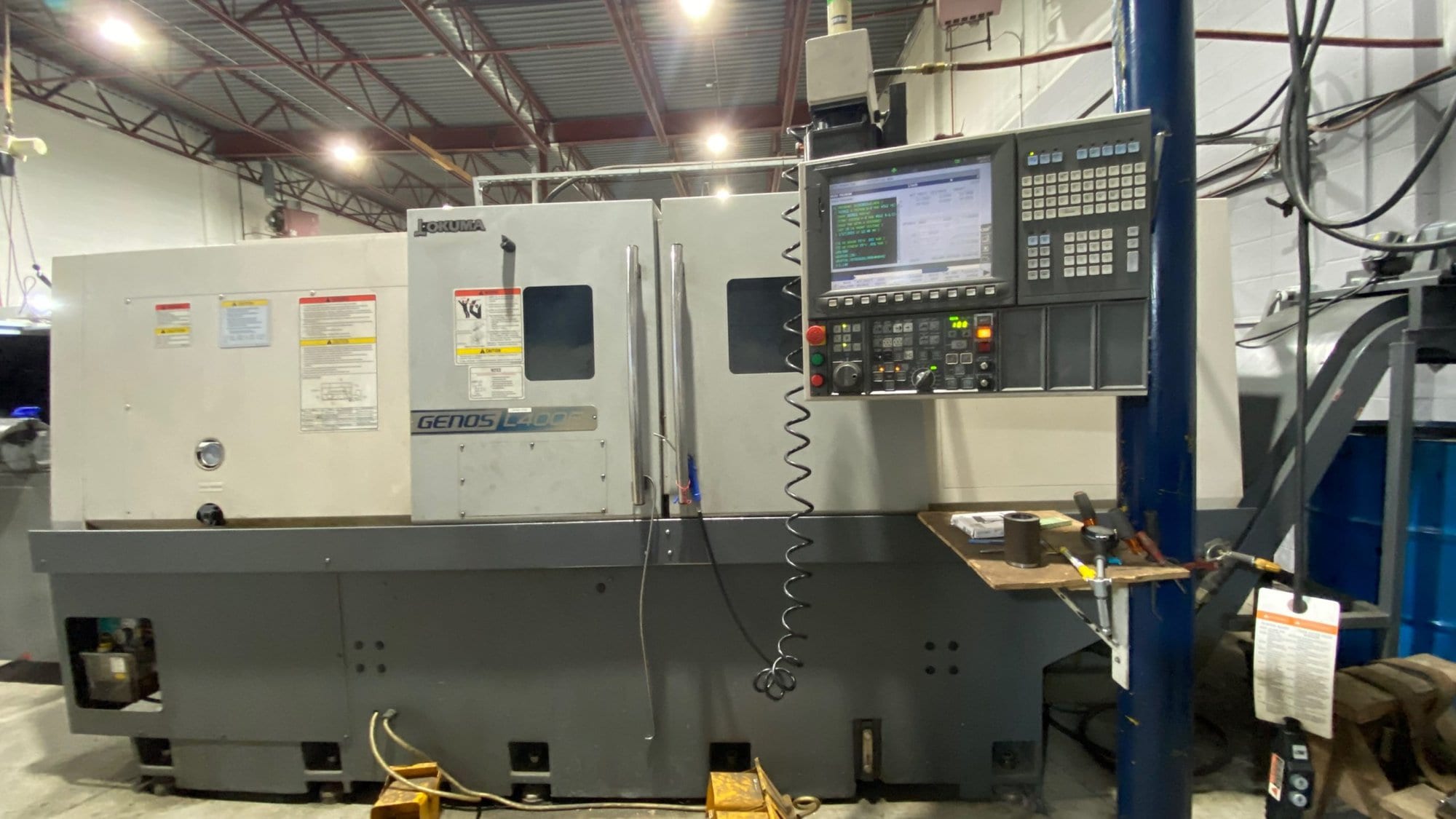 Okuma Genos L400E CNC Lathe, 2012 - Under Power, Chip Conveyor