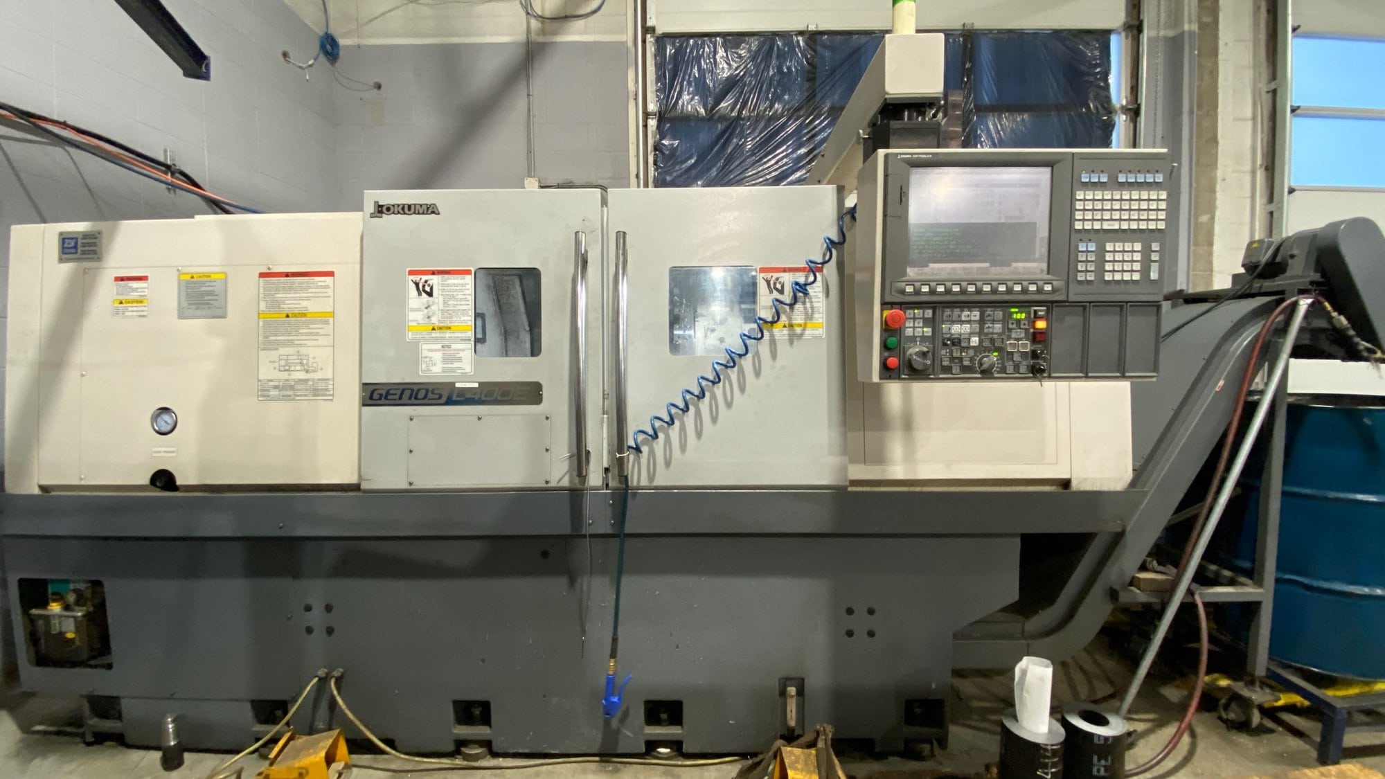 Okuma Genos L400E CNC Lathe, 2013 - Under Power, Chip Conveyor