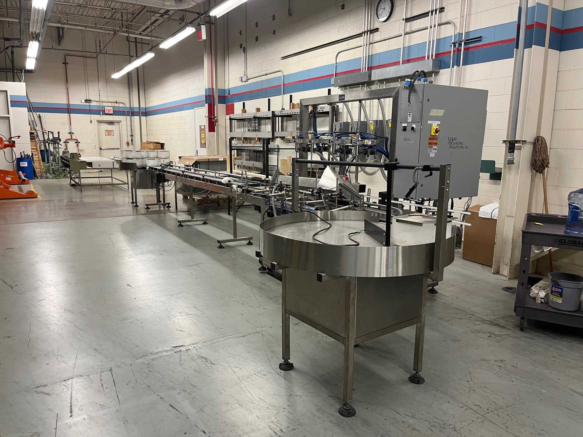 Liquid Packaging Solutions 4 Head Liquid Filling Line, In-feed and Out-feed Conveyor, and rotating collection table. 2017 - Image 4
