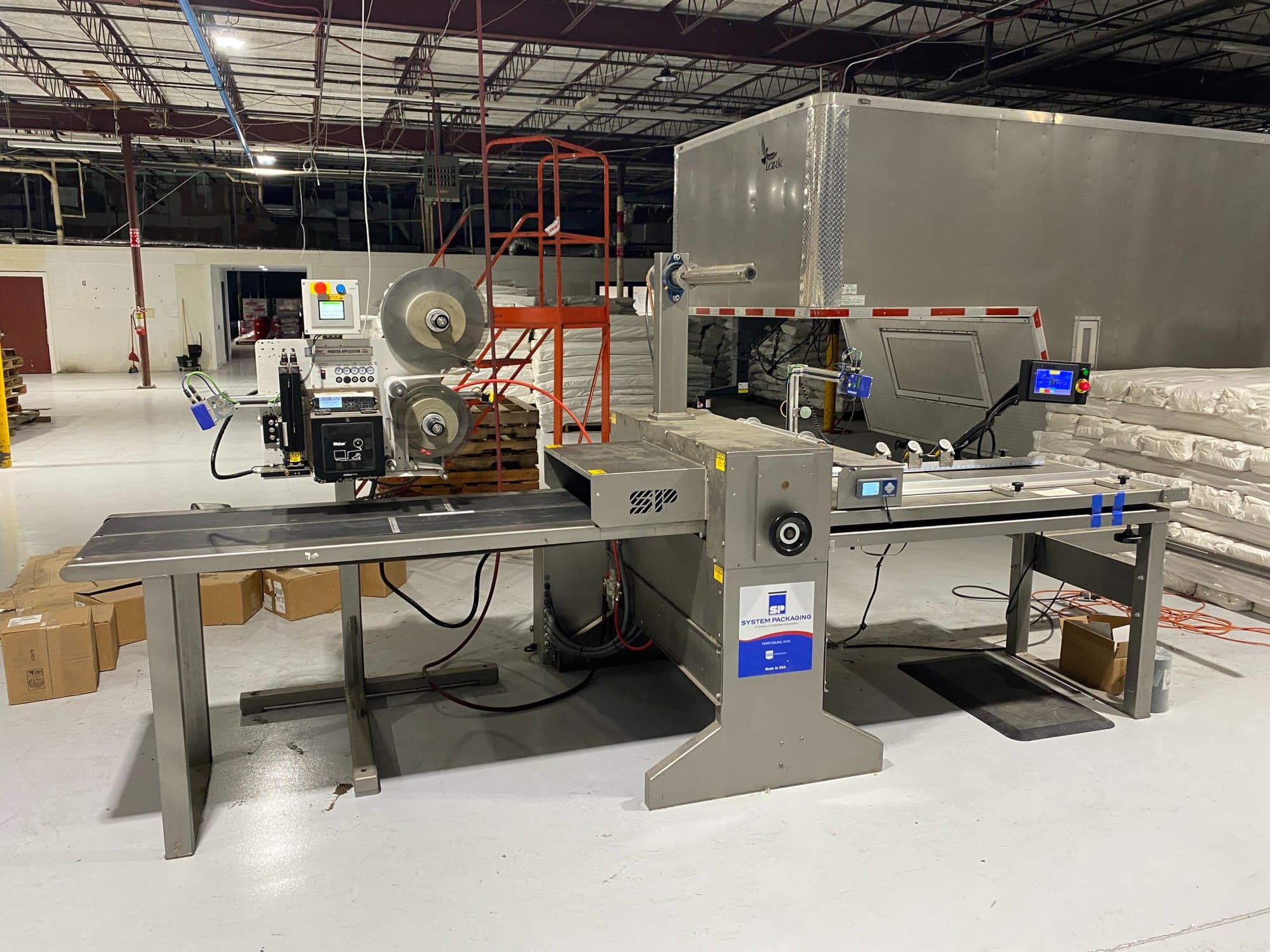 System Packaging 900-24 3B Labeler, 2020 - Weber Box Label Printer/Applicator Model: 5300 L.H. DOM, 1 Pallet of Cold Seal Material Included **Pre-Removal Pricing**