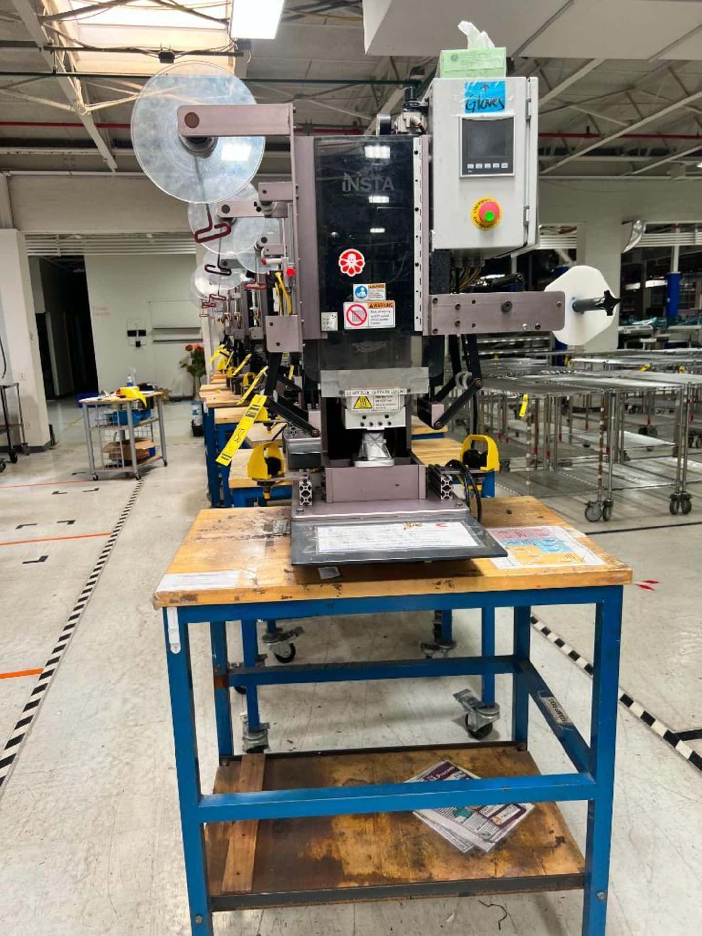 insta graphic systems heat press machine on a rolling table
