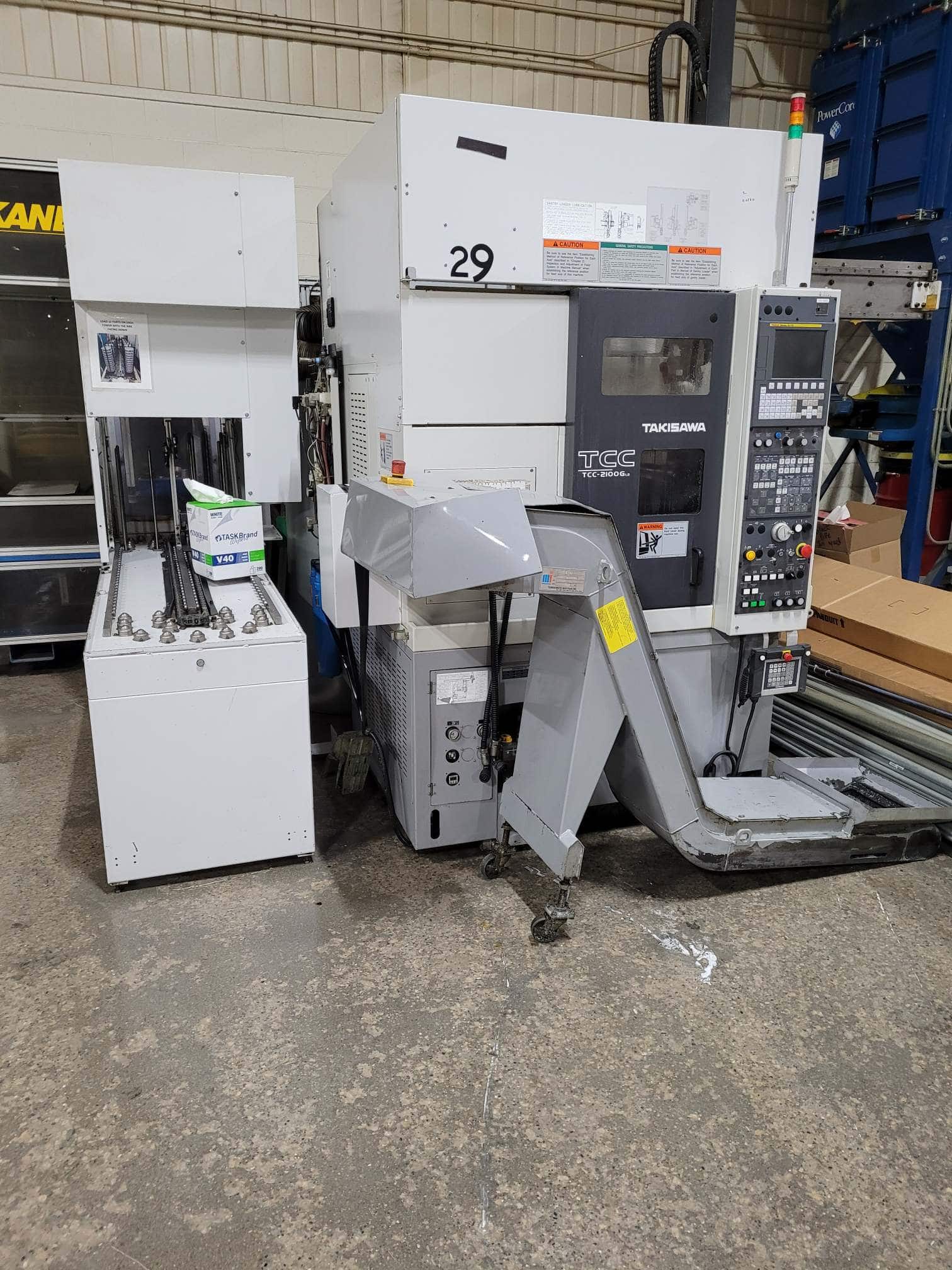 Takisawa TCC-2100G L2 CNC Lathe, 2017 - Fanuc Control, Chip Conveyor, Carousel Feeder