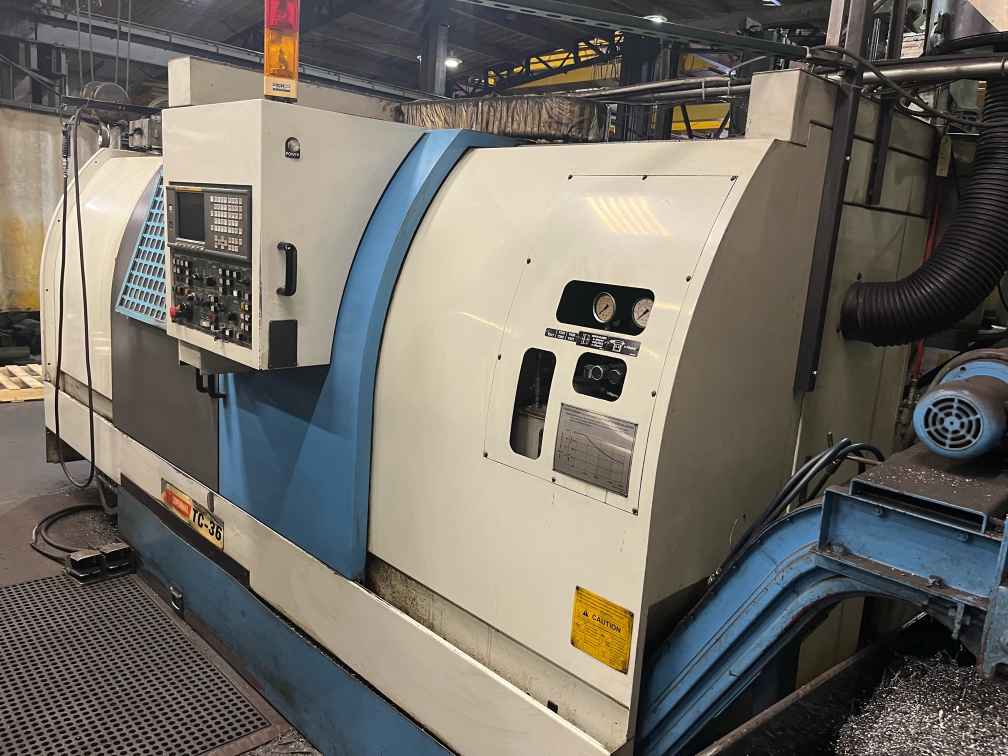 YCM TC-36 CNC Lathe, 2002 - Fanuc Control, Chip Conveyor