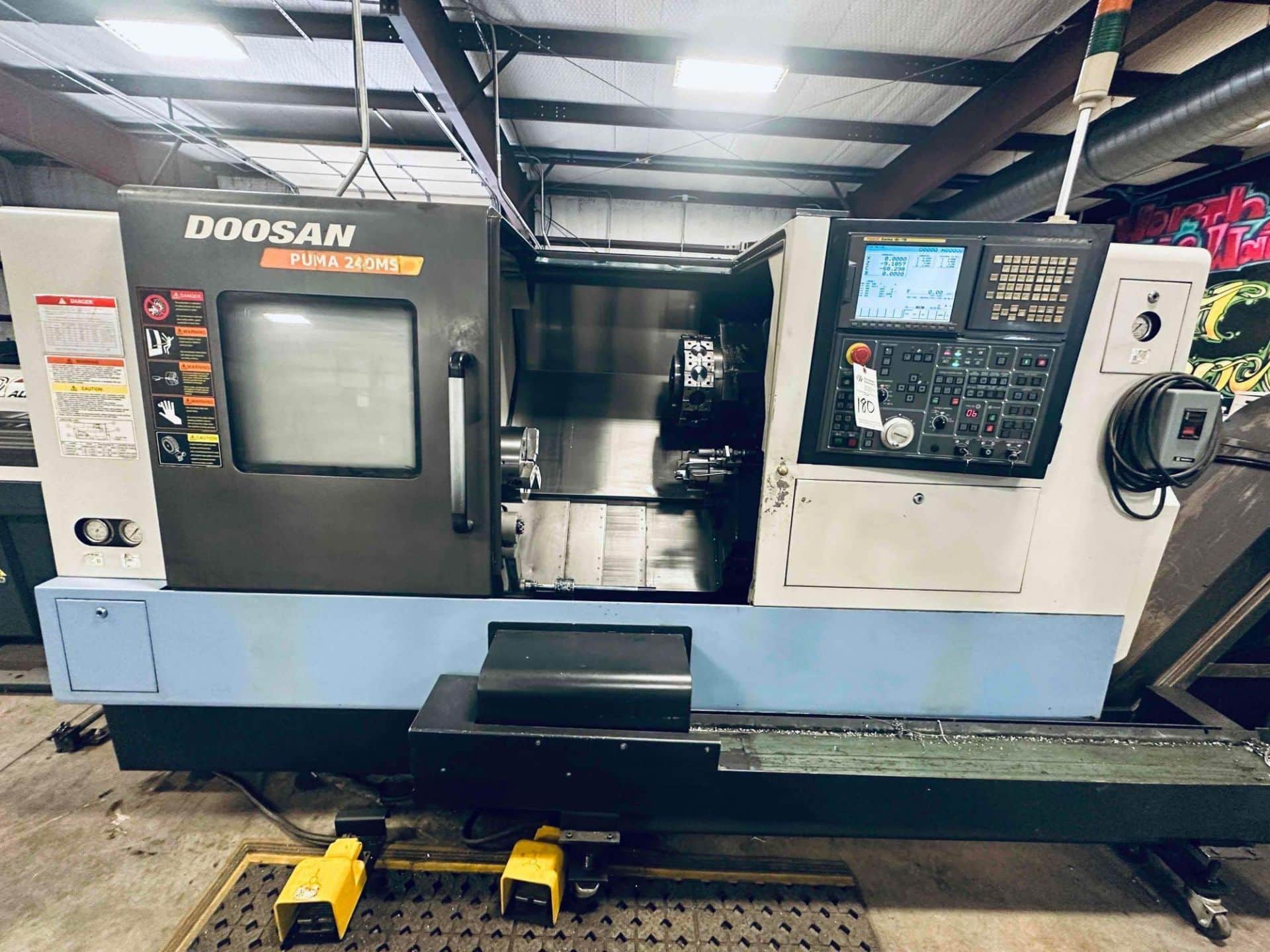 DOOSAN PUMA 240 MS TURNING CENTER WITH TURBO SYSTEMS CHIP CONVEYOR