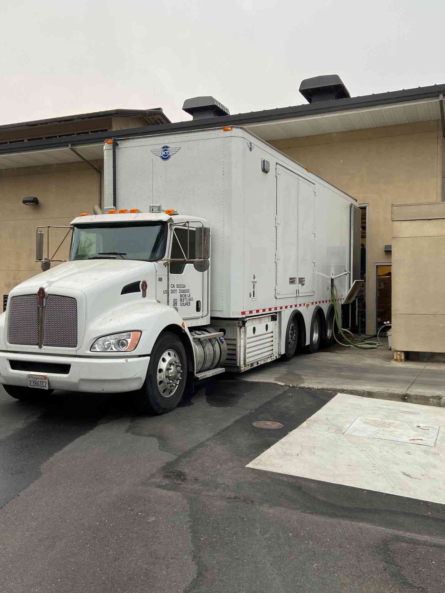 12-Head Mobile Kenworth GAI Filler and Labeler Truck