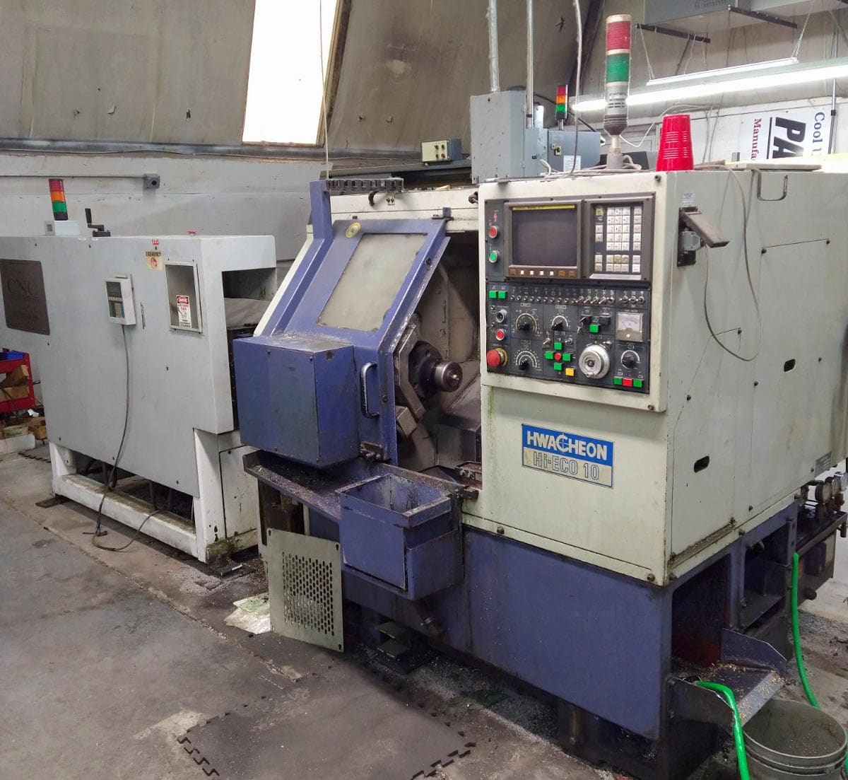 Hwacheon Hi-Eco10 CNC Lathe, 1996 - Bar Feeder, Tailstock, Tool Setter, Fanuc