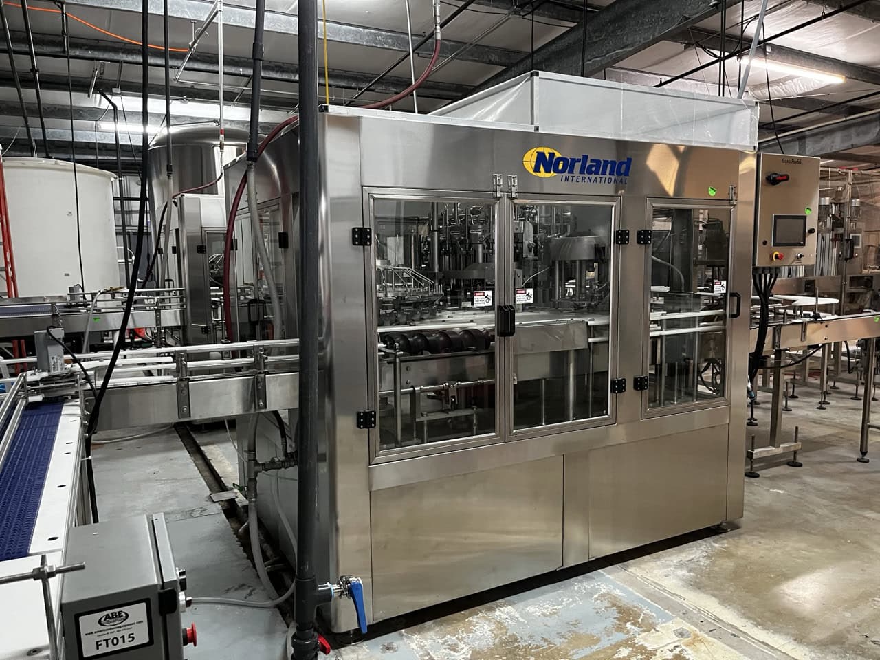 Norland International Complete line with (2) GlassPak66 Monoblock Systems (16oz and 25 Oz) for Glass or Aluminum with Fluid Solutions 3 Head ROPP Capper, 2020: - Image 2
