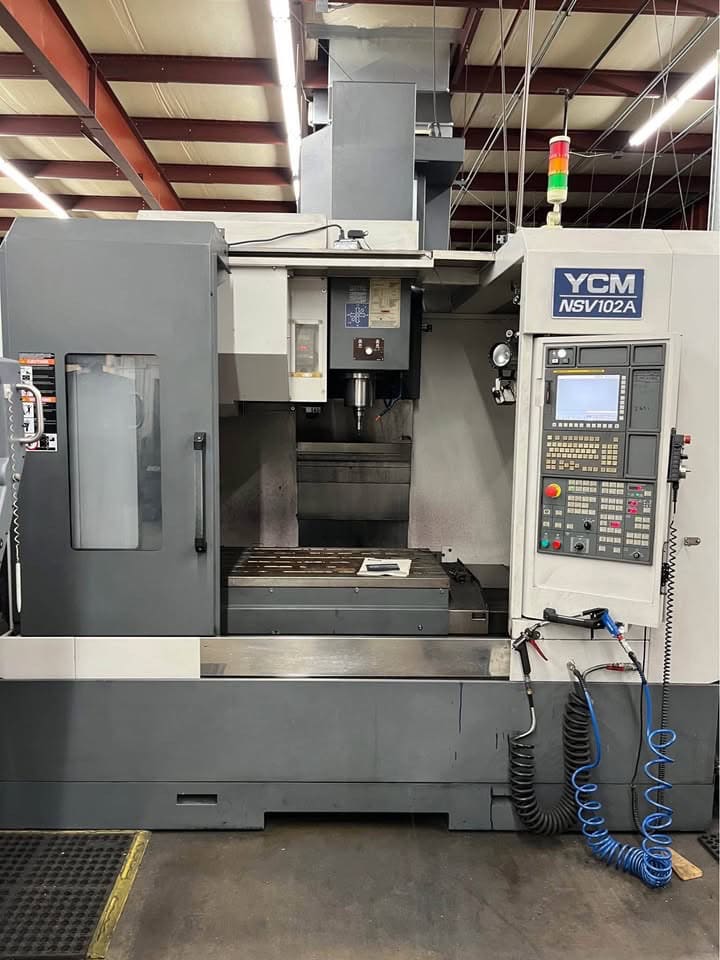 YCM NSV 102A VMC, 2012 - Chip Auger